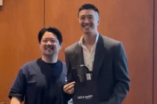 edward sher receiving first place award at ucla dentistry science day