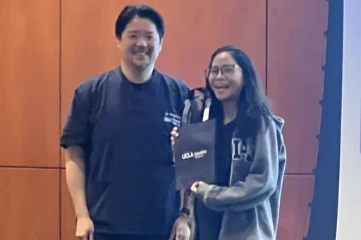cathy chen receiving the second place award at the ucla dentistry science day