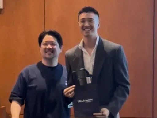 edward sher receiving first place award at ucla dentistry science day