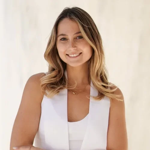 Michaela Schulman profile photo wearing a white dress